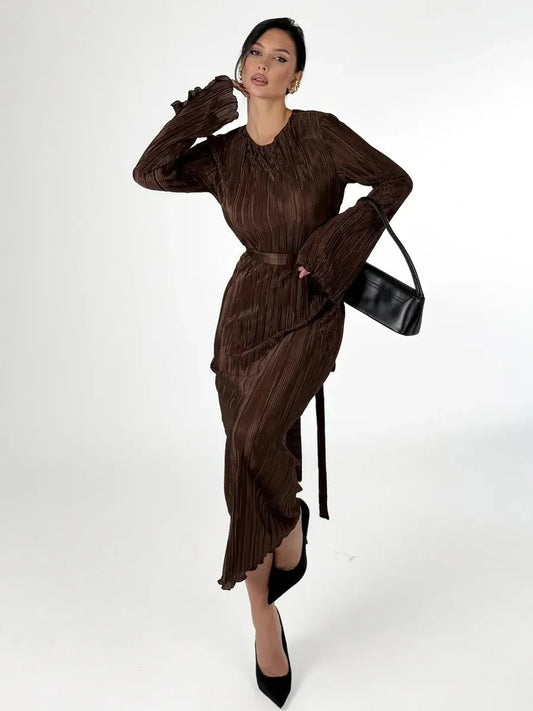 Model wearing Mocha Drape Maxi Dress with pleated flow, round neckline, and matching belt, exuding elegance in chocolate hue.