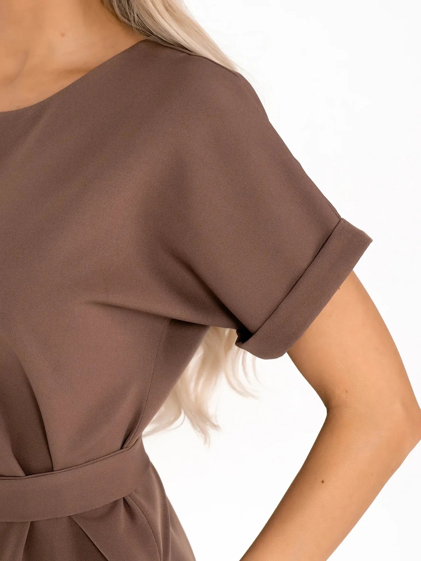 Close-up of Mocha Frame dress showcasing its sleek short sleeves and structured design in rich taupe tones.