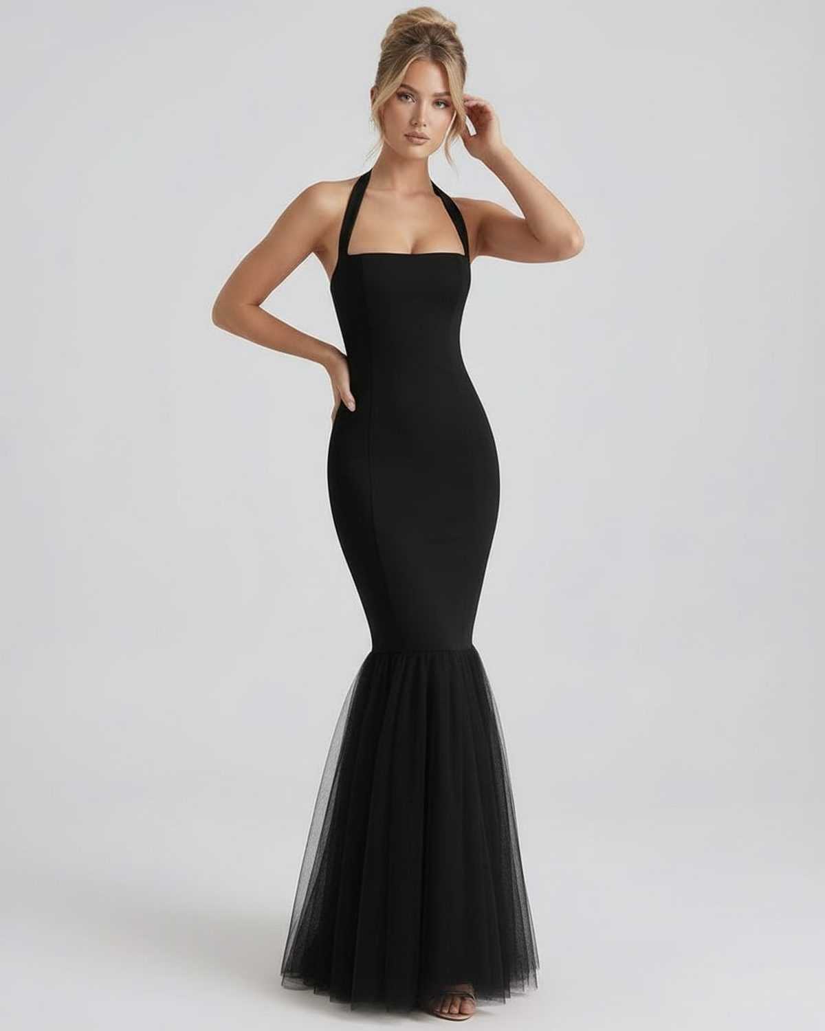 Monaco Maxi Dress by Lauven, black bodycon design with halter neck and tulle hem for elegant movement.