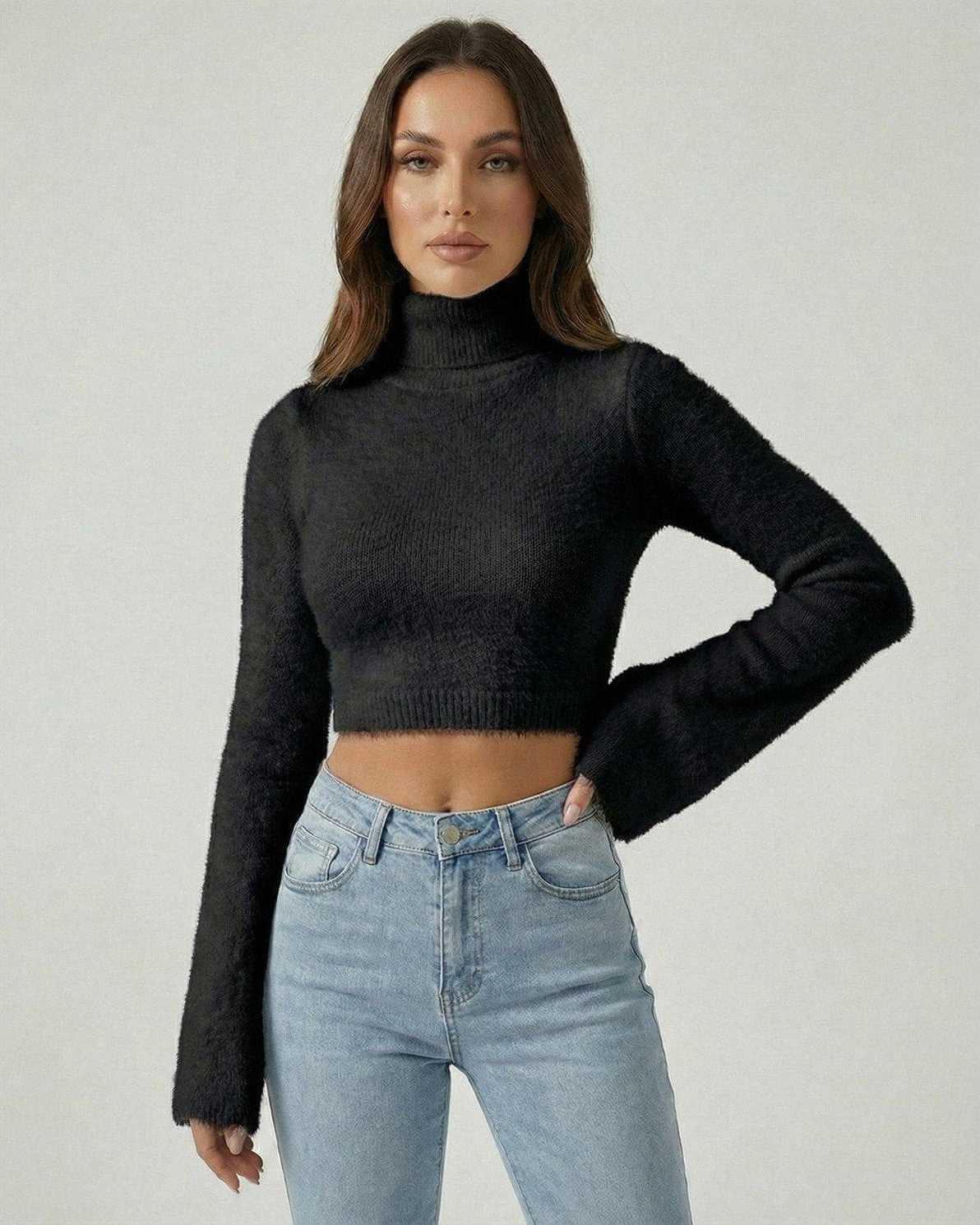 Monaco Pullover by Lauven – Women’s black high neck cropped sweater with long sleeves, styled with high-rise jeans.