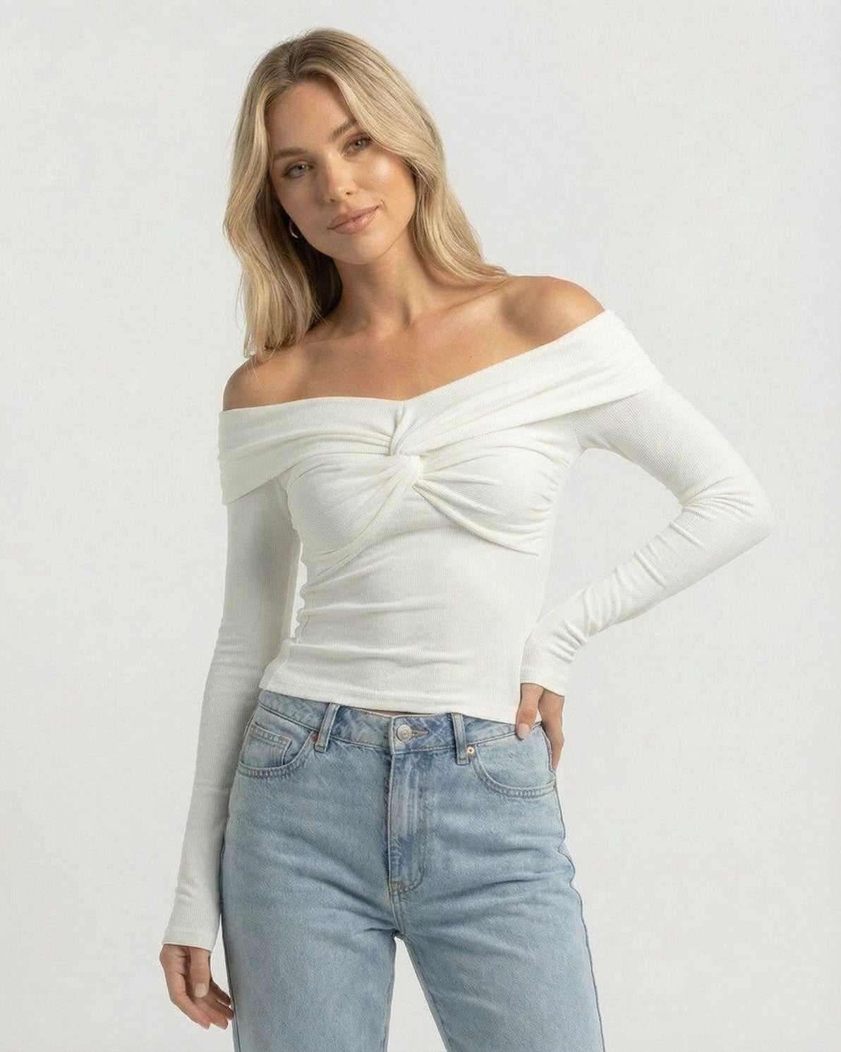 Monaco Top by Lauven – Women’s off the shoulder long sleeve white top in ribbed knit with twist-front detail.