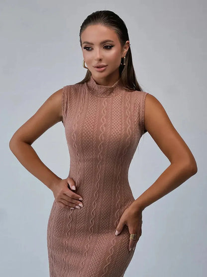 Model showcasing Museline Maxi Dress in cocoa-toned jacquard, featuring intricate cable patterns and a sleek bodycon fit.