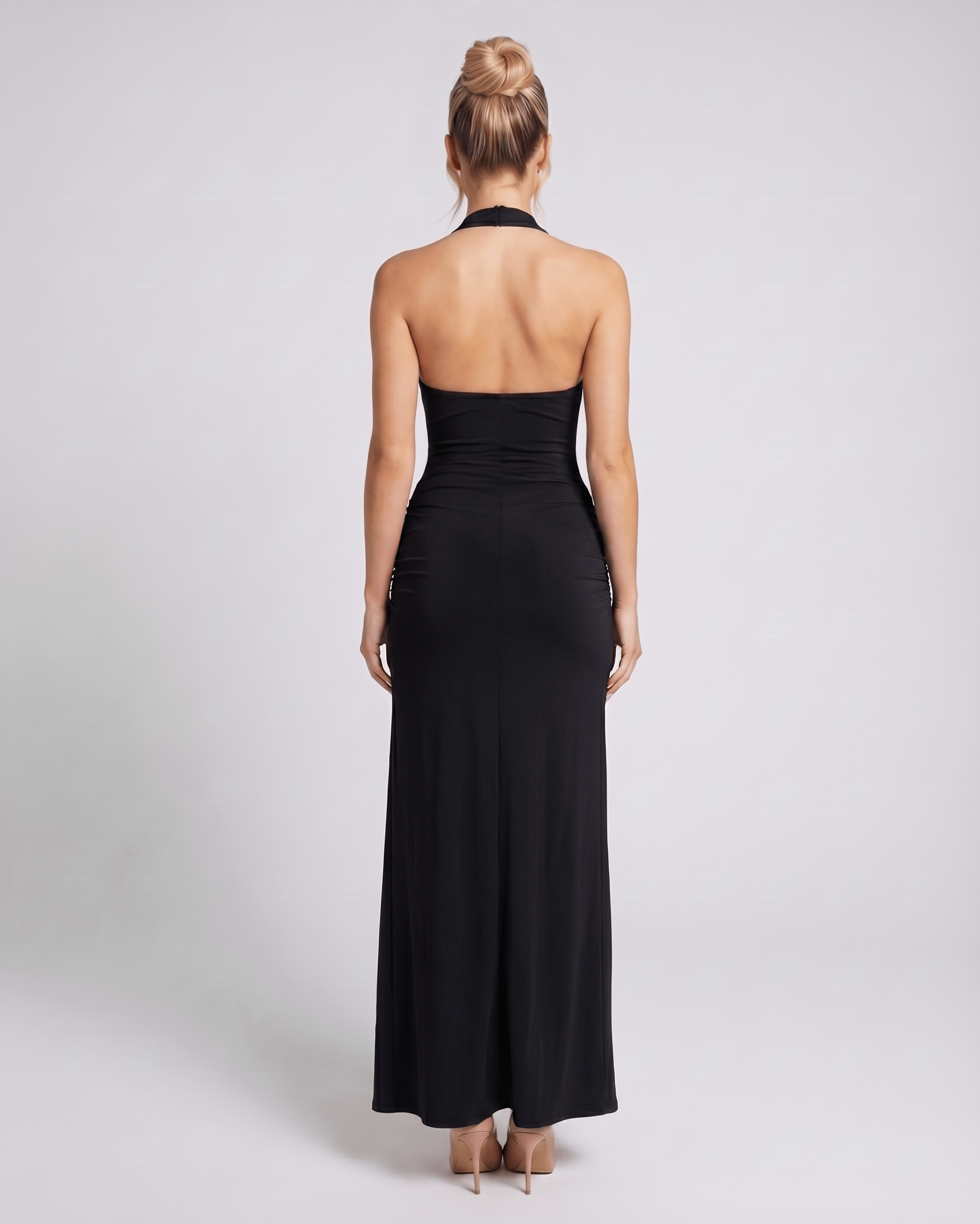 Back view of Lauven's black v-neck maxi dress, highlighting its sleek design and modern halter cut.