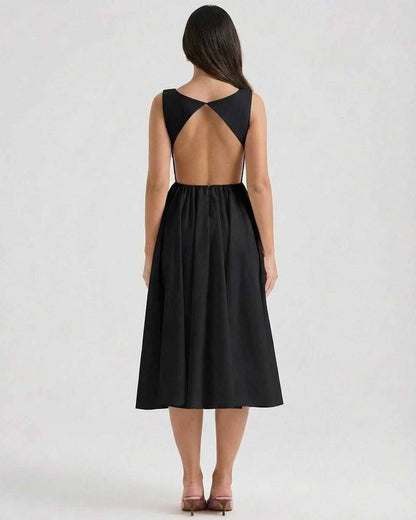 Back view of Noctura Midi Dress by Lauven, showcasing an elegant A-line silhouette and an open back design.