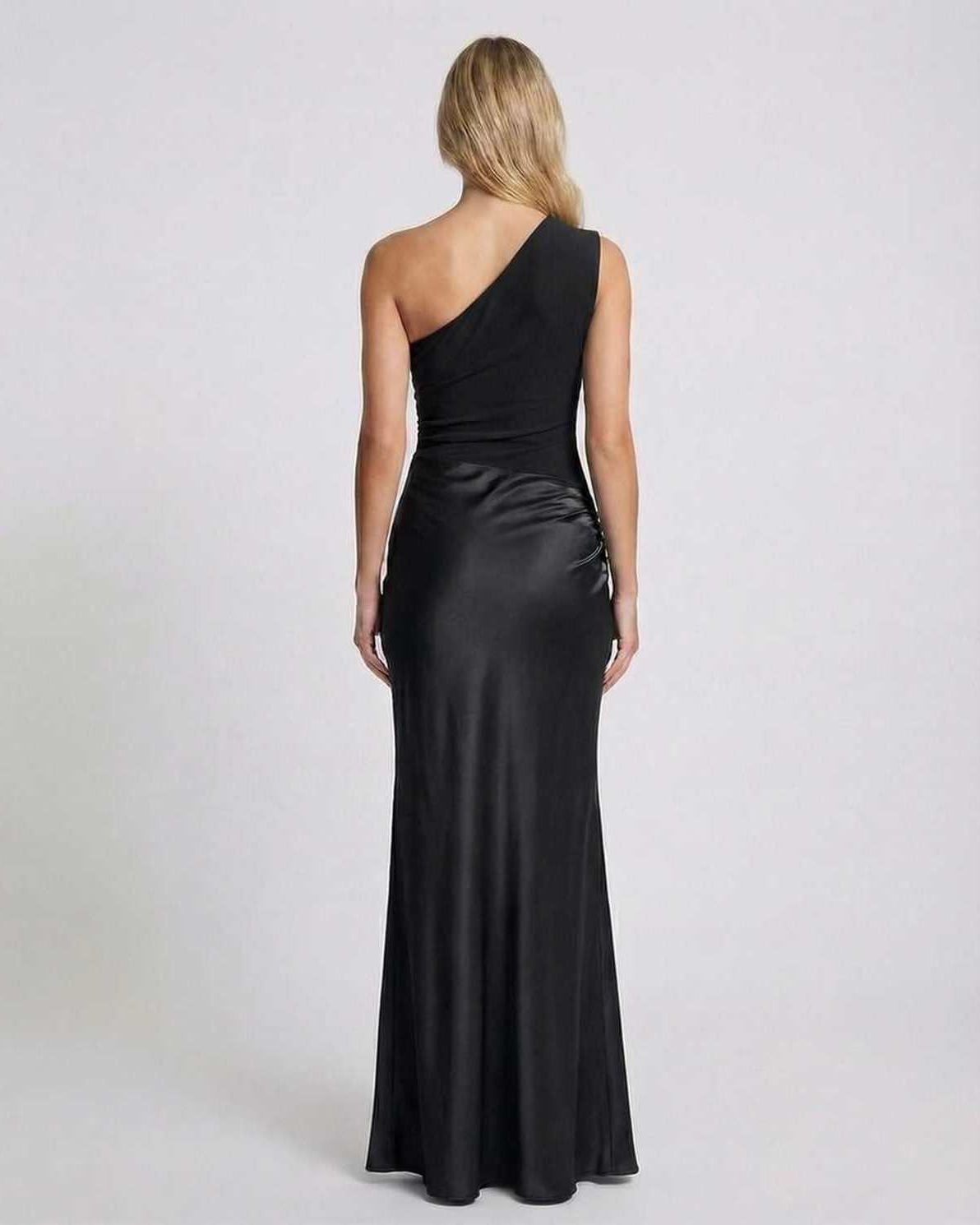 Back view of Noelle Maxi Dress, one shoulder design, sleek black satin fabric, elegant for formal occasions by Lauven.