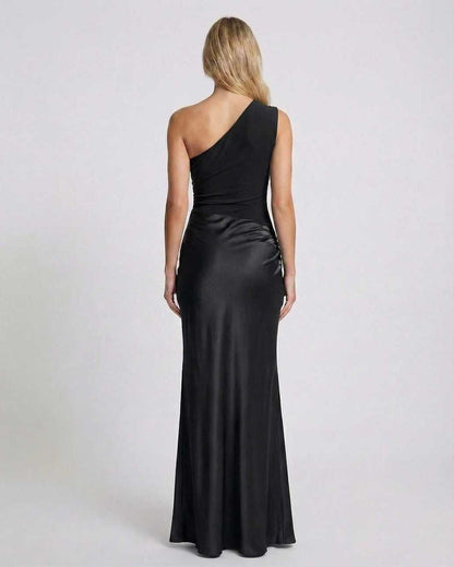 Back view of Noelle Maxi Dress, one shoulder design, sleek black satin fabric, elegant for formal occasions by Lauven.