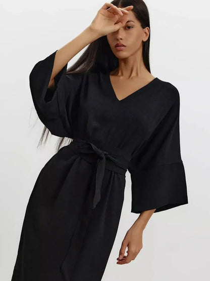 Noir Drift Maxi Dress featuring kimono sleeves, V-neckline, and cinched waist belt in a fluid, black drape.