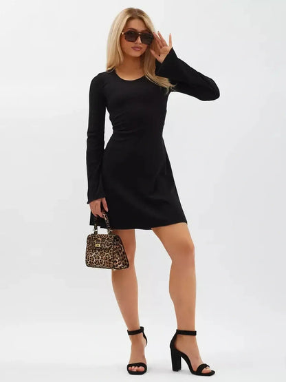 Noir Flare Mini Dress featuring long flared sleeves, a tie waist, and elegant black knit design, perfect for versatile styling.