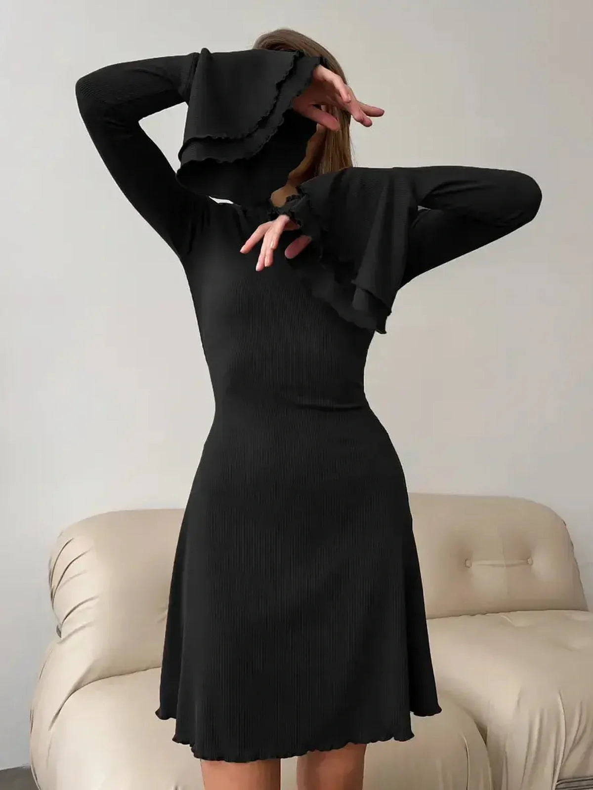 Noir Flare Mini black dress with flared cuffs and tie waist, perfect for weddings, proms, and special occasions.