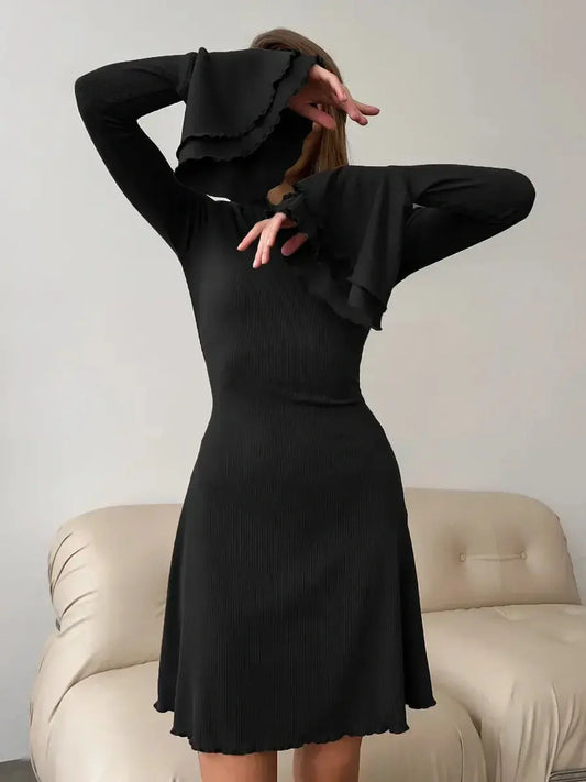 Noir Flare Mini black dress with flared cuffs and tie waist, perfect for weddings, proms, and special occasions.