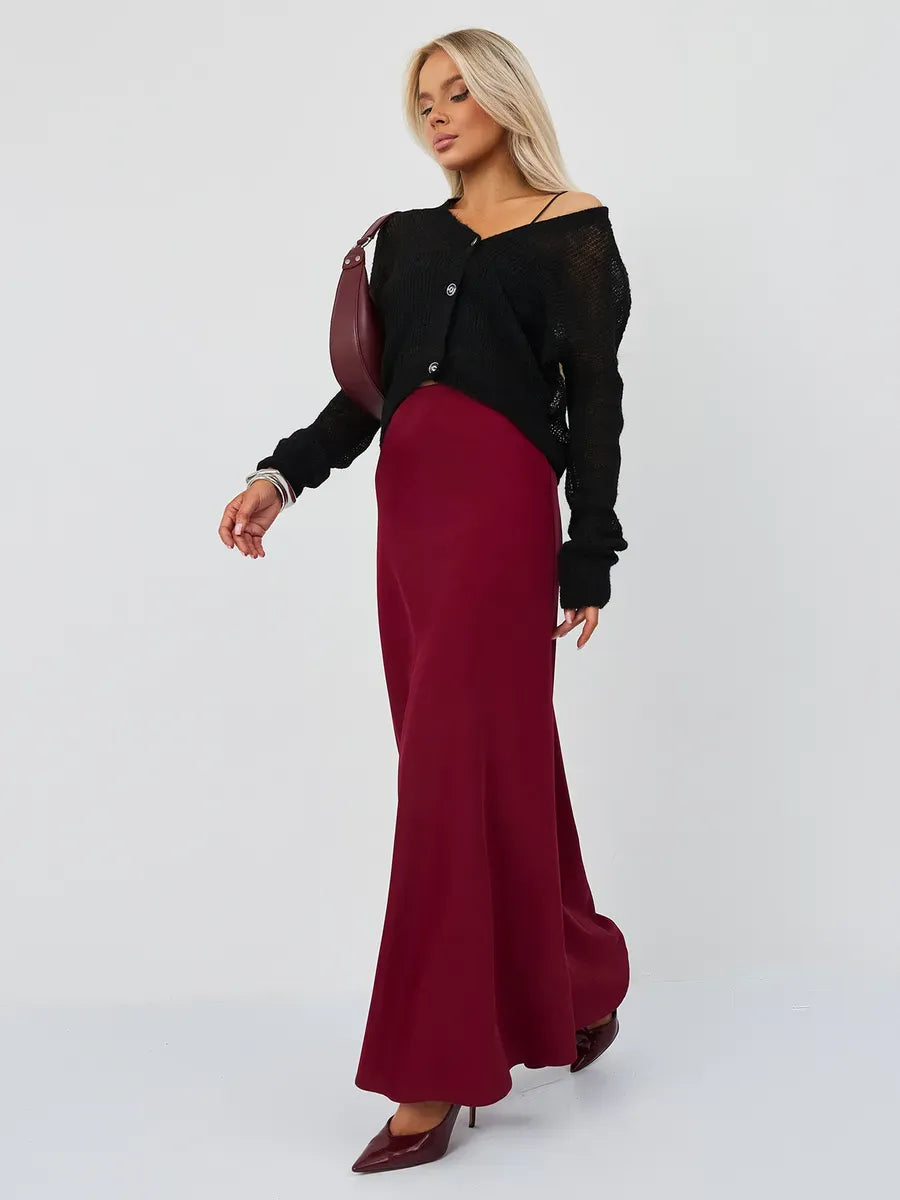 Model wearing Noir Luxe Cardigan by Lauven, oversized mohair-blend knitwear in black, styled with a burgundy skirt.
