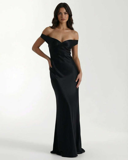 Noir Maxi Dress - Black satin off shoulder dress by Lauven featuring sleek silhouette and elegant finish.