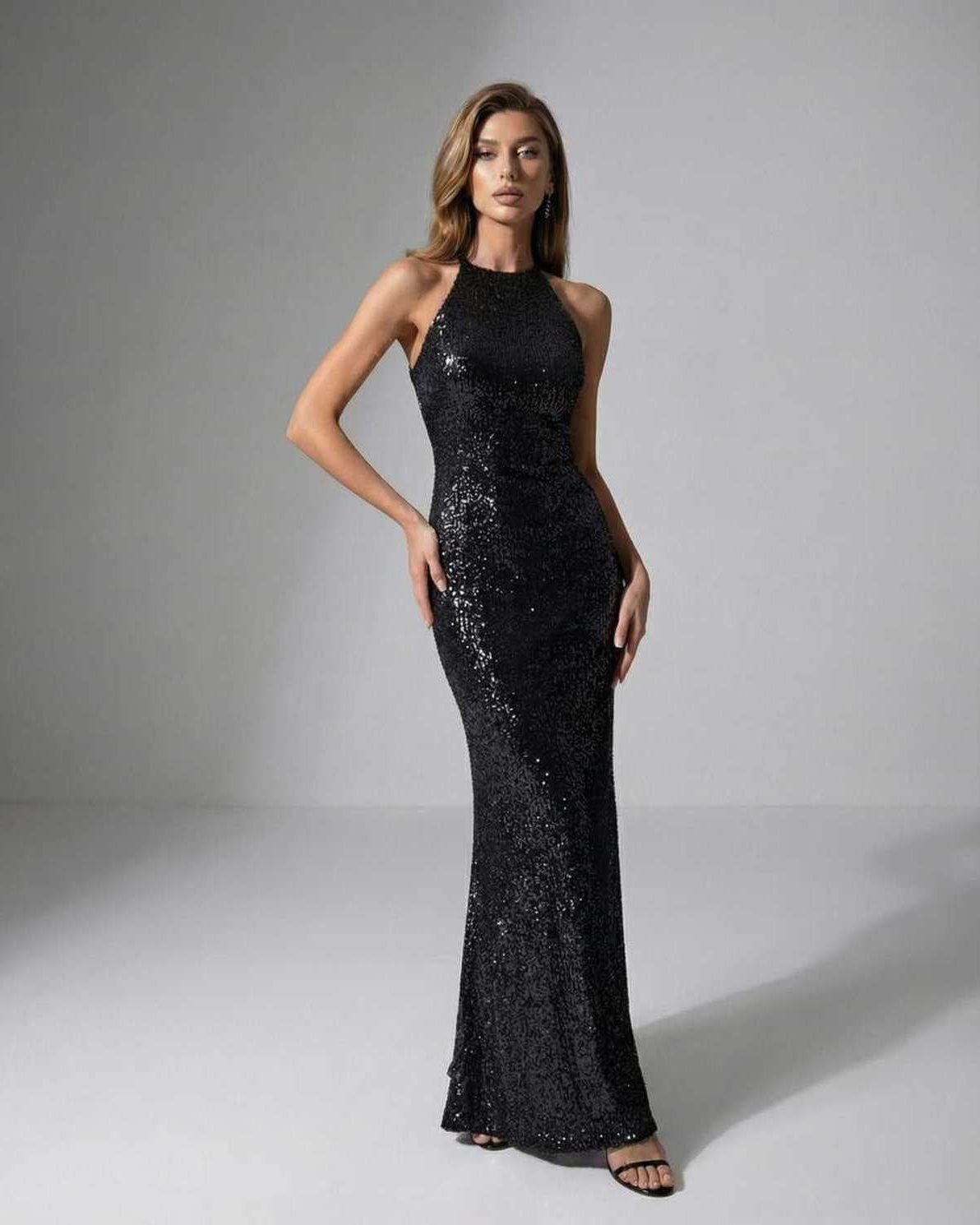 Noir Maxi Dress by Lauven, featuring a black sequin design, halter neck, and elegant evening silhouette for a chic look.