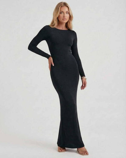 Lauven Noir Maxi Dress featuring an elegant black long sleeve design and an open back for sophisticated style.