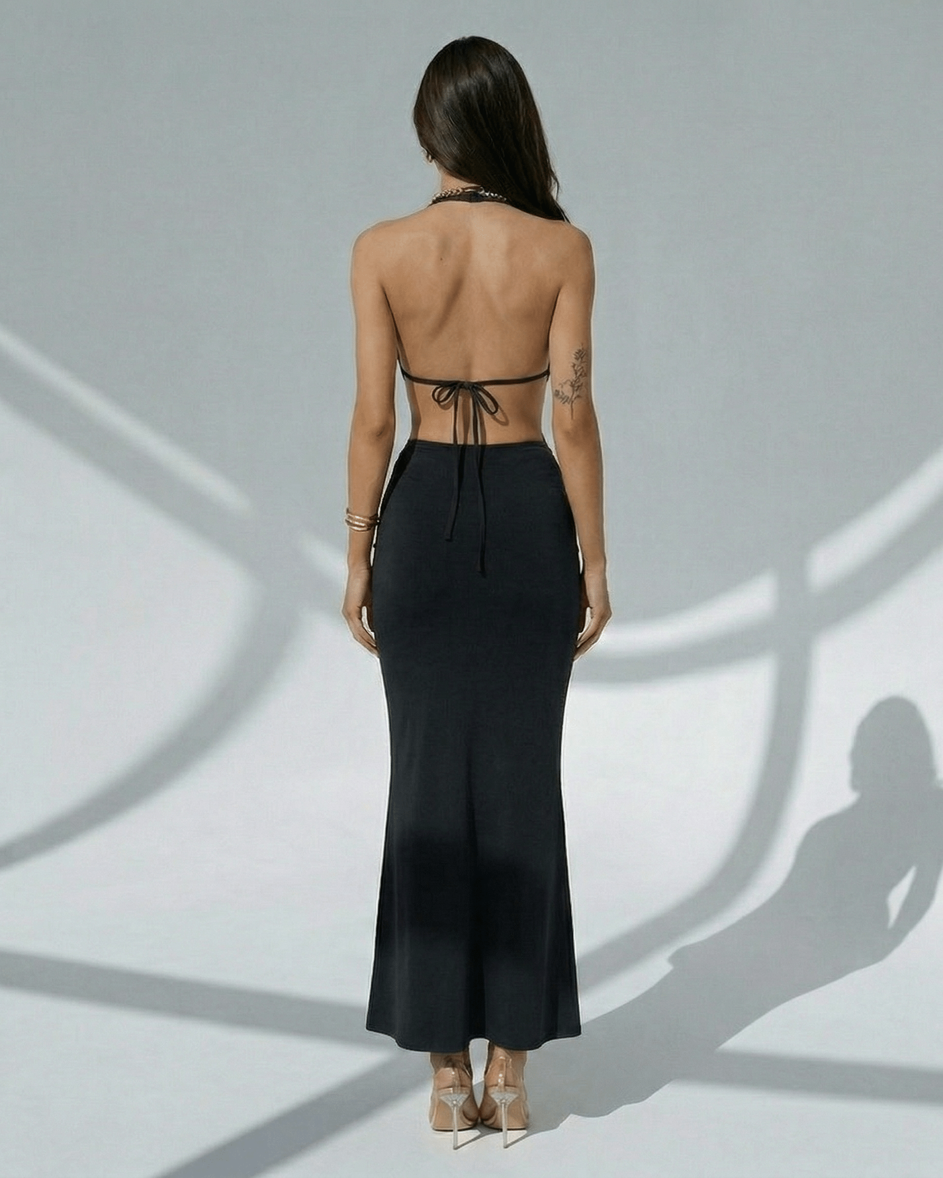Noir Maxi Dress by Lauven, elegant black bodycon with deep V-neck, adjustable waist, sleek design.