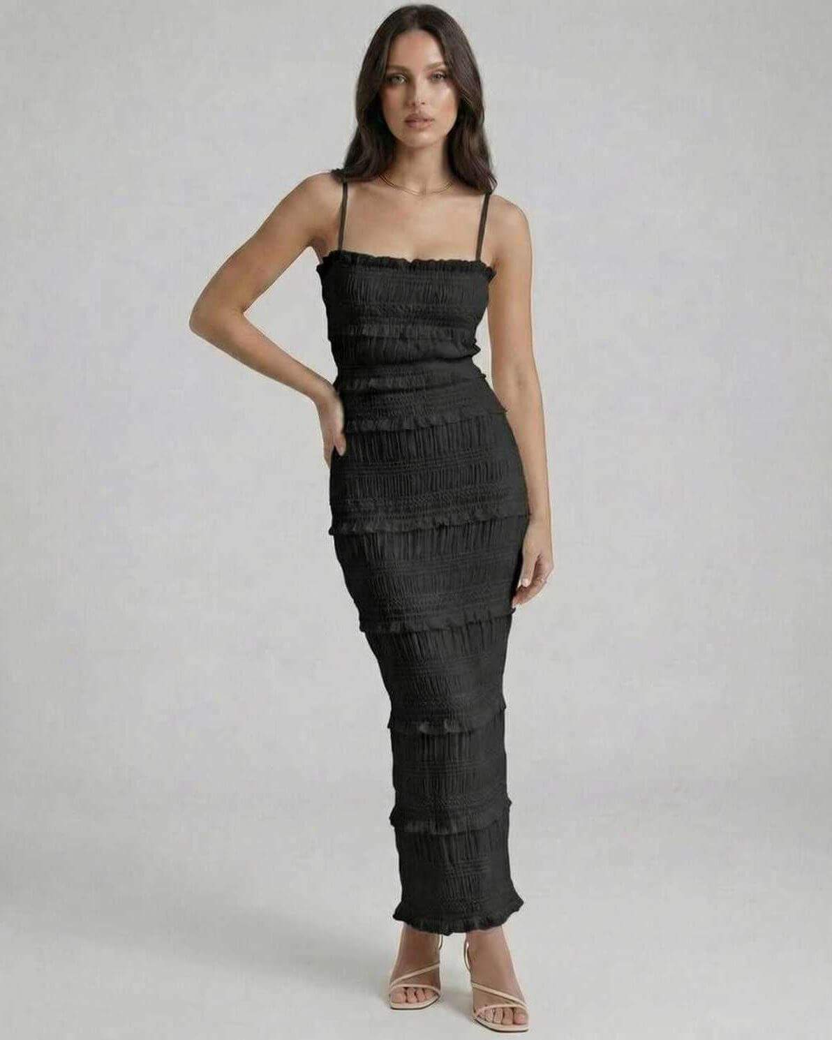 Lauven Noir Maxi Dress showcasing an elegant sheath silhouette with textured pleats and subtle ruffles in classic black.