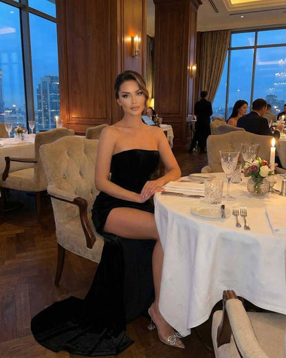 Noir Maxi Dress by Lauven, a strapless velvet gown worn at an elegant dinner setting.