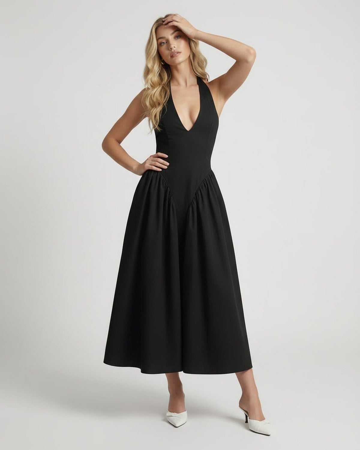 Noir Midi Dress featuring a fitted halter neck and backless silhouette, embodying sophistication from Lauven.