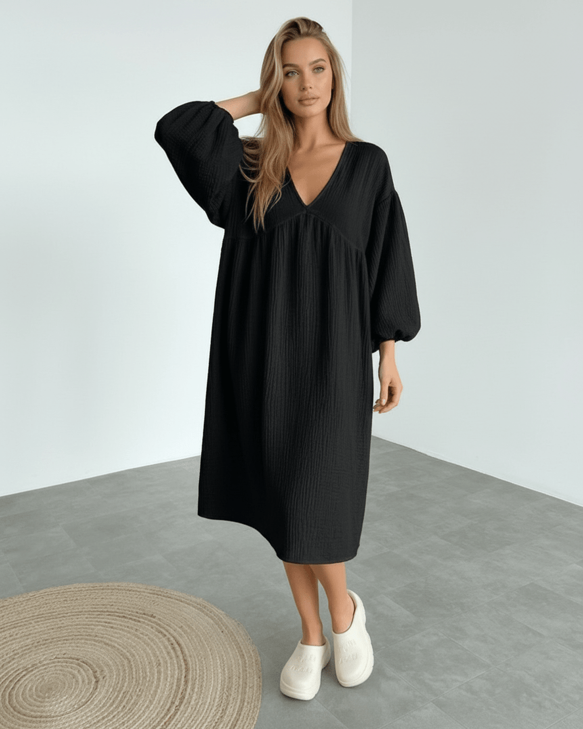 Noir Midi Dress - Black cotton dress with puff sleeves by Lauven, offering timeless elegance and all-day comfort.