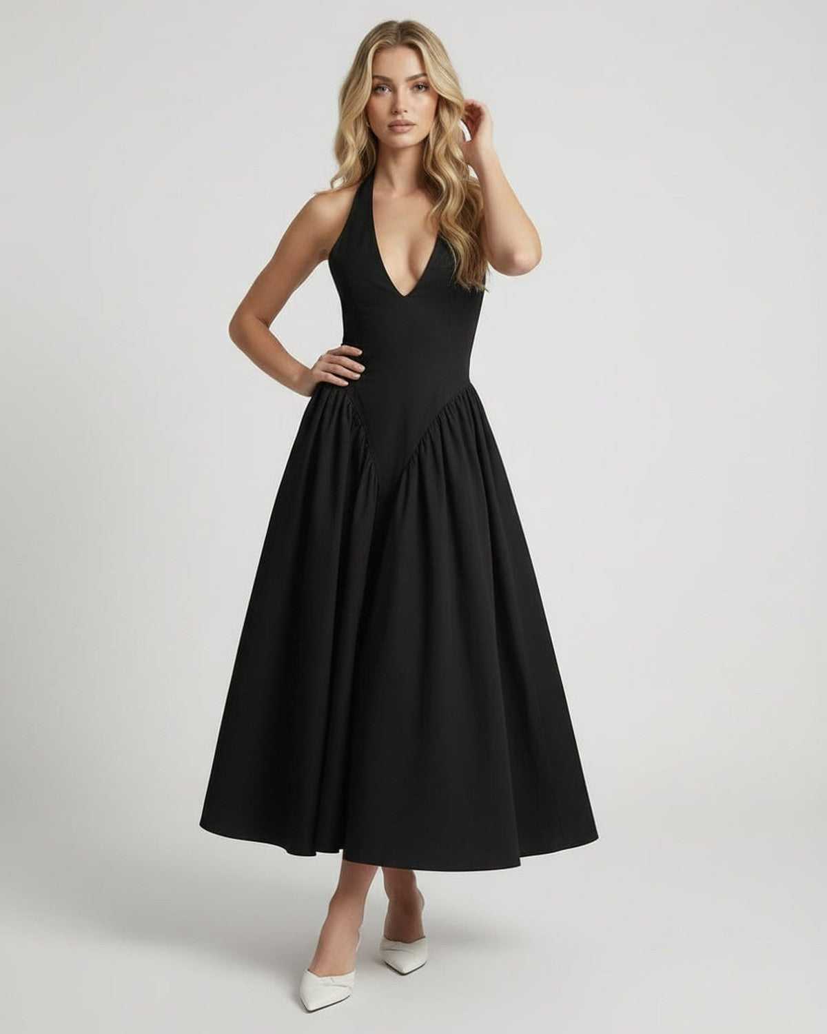 Noir Midi Dress: Black halter neck, backless, elegant silhouette by Lauven, perfect for sophisticated women's fashion.