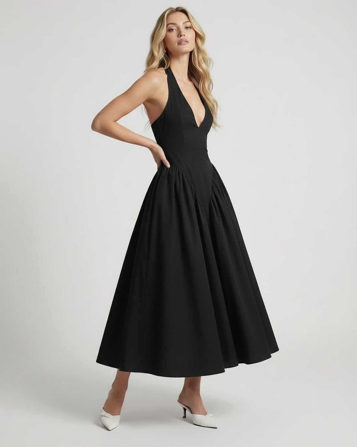 Noir Midi Dress from Lauven featuring halter neck, backless design, and elegant silhouette for a timeless look.