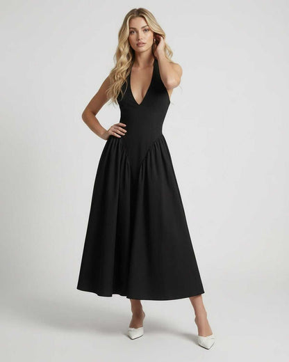 Noir Midi Dress featuring a halter neck, backless silhouette, and elegant design by Lauven. Perfect for a chic look.