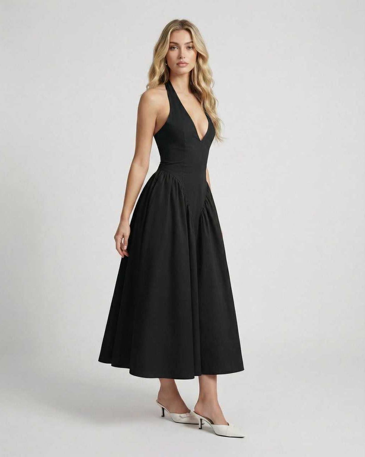 Noir Midi Dress by Lauven, featuring halter neck, backless design, and elegant black midi silhouette for modern sophistication.