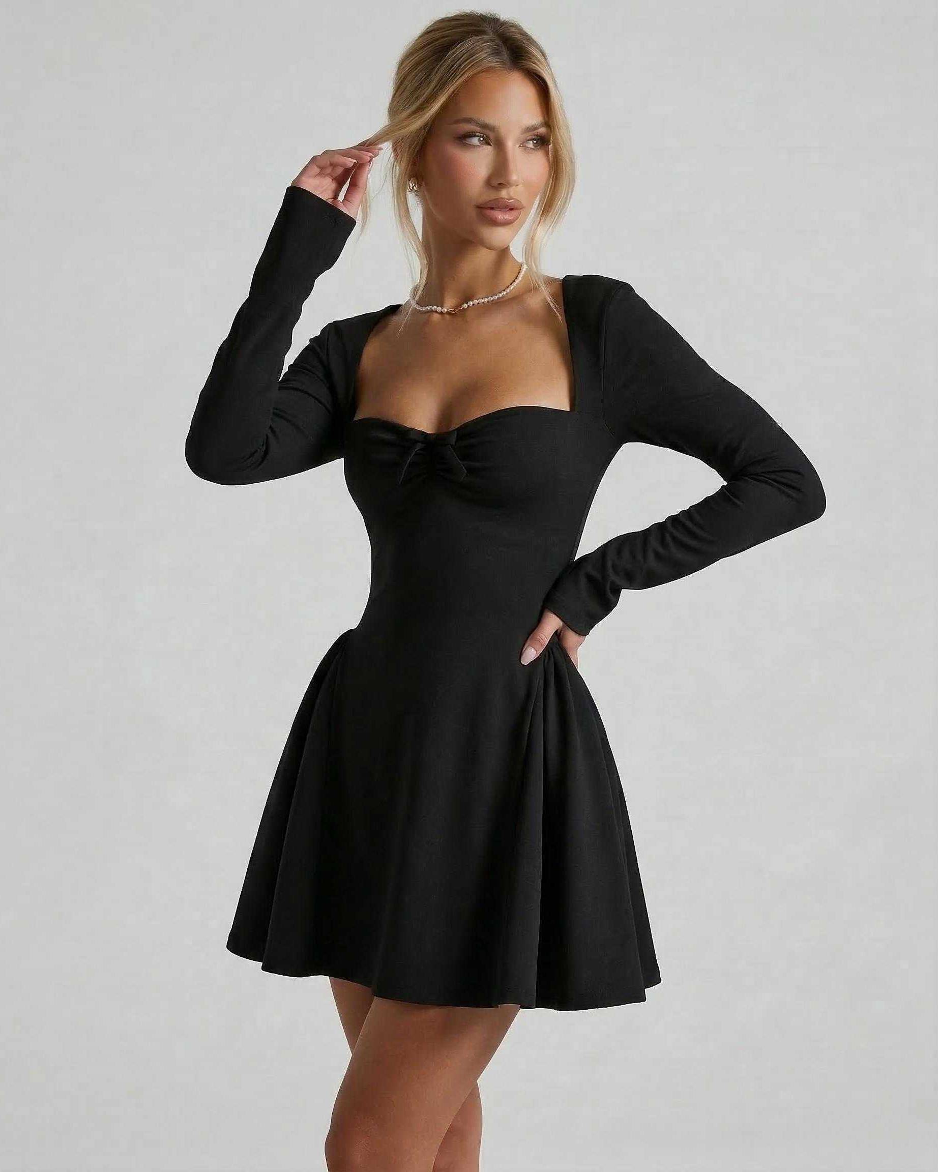 Noir Mini Dress by Lauven featuring a flattering fit-and-flare silhouette and delicate ruched bow detail.