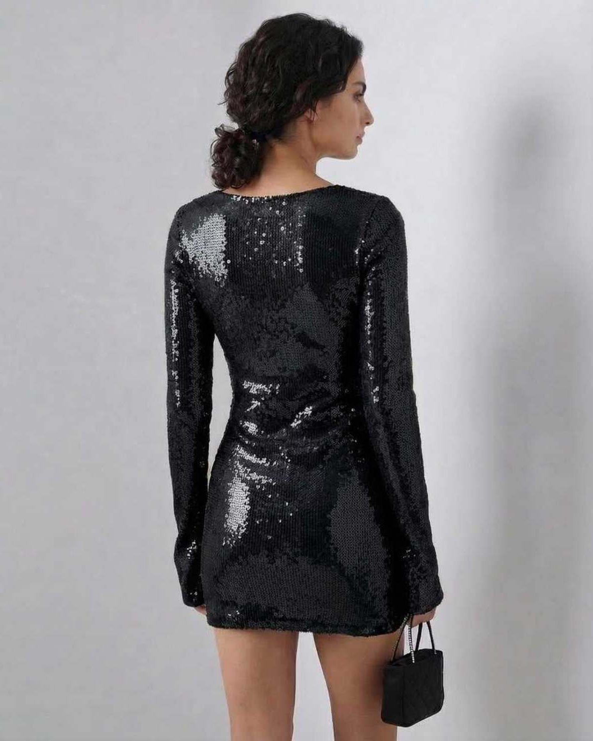 Lauven Noir Mini Dress with full sequins and flared sleeves, showcasing a sleek silhouette from the back.