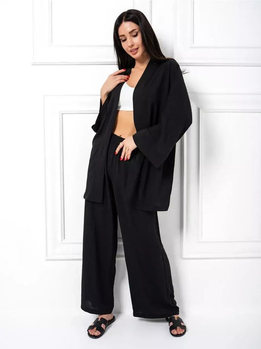 Noir Suit Set by Lauven showing a chic oversized two-piece set in classic black with wide-leg trousers.