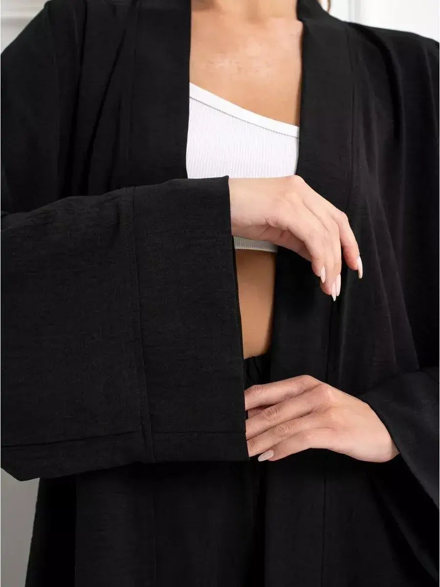 Noir Suit Set by Lauven, featuring chic oversized black jacket and stylish wide sleeves for a modern, elegant look.