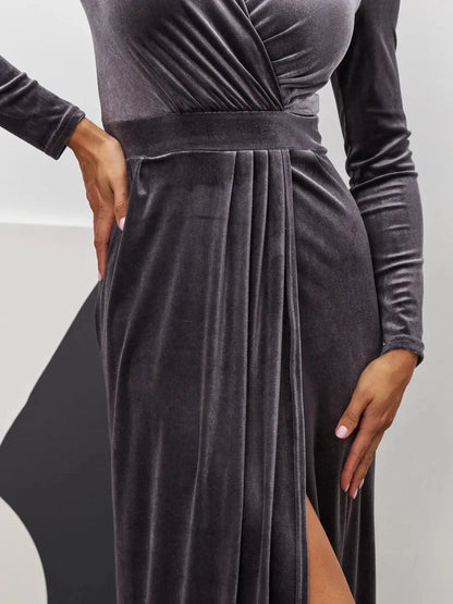 Close-up of the Noir Whisper Maxi Dress, showcasing plush graphite velvet and a thigh-high slit for a luxurious, elegant look.