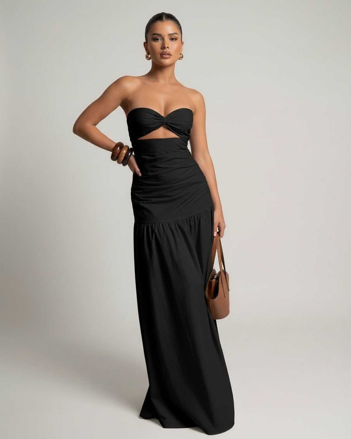 Noira Maxi Dress - Black strapless maxi dress with cutout high waist silhouette by Lauven, offering a sleek and elegant fit.