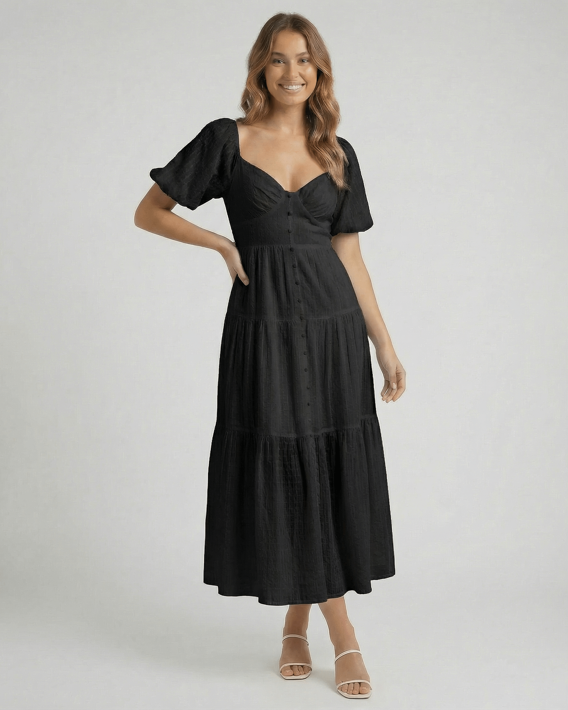 Noira Midi Dress by Lauven – stylish black A-line midi dress with puff sleeves and V-neckline.