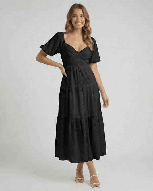 Noira Midi Dress by Lauven – stylish black A-line midi dress with puff sleeves and V-neckline.