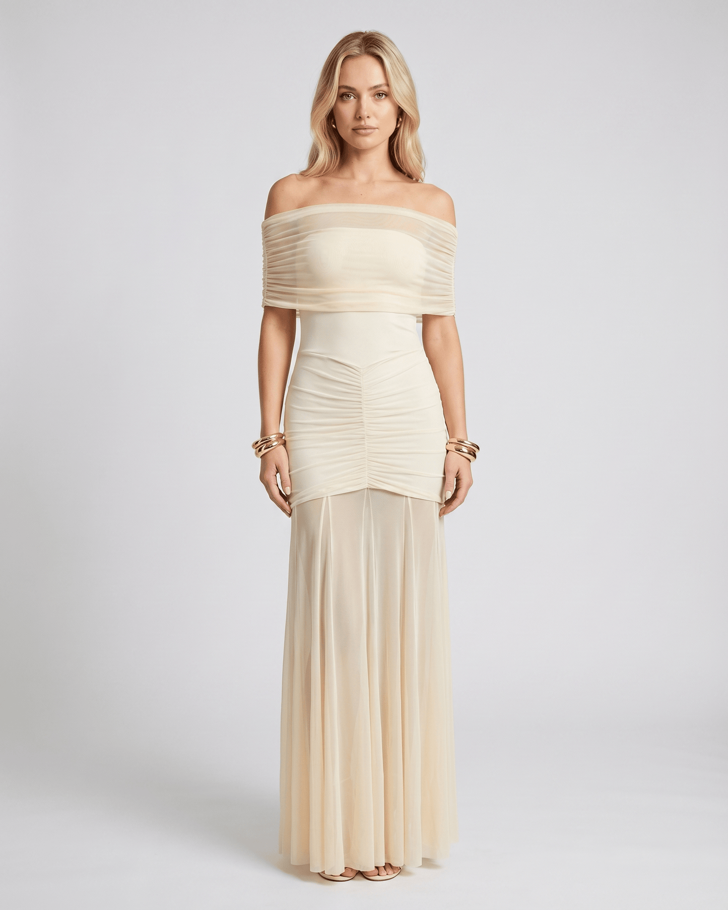 Noirline maxi dress by Lauven, featuring off-shoulder neckline, ruched bodice, elegant flowing sheer panel, and stunning movement.