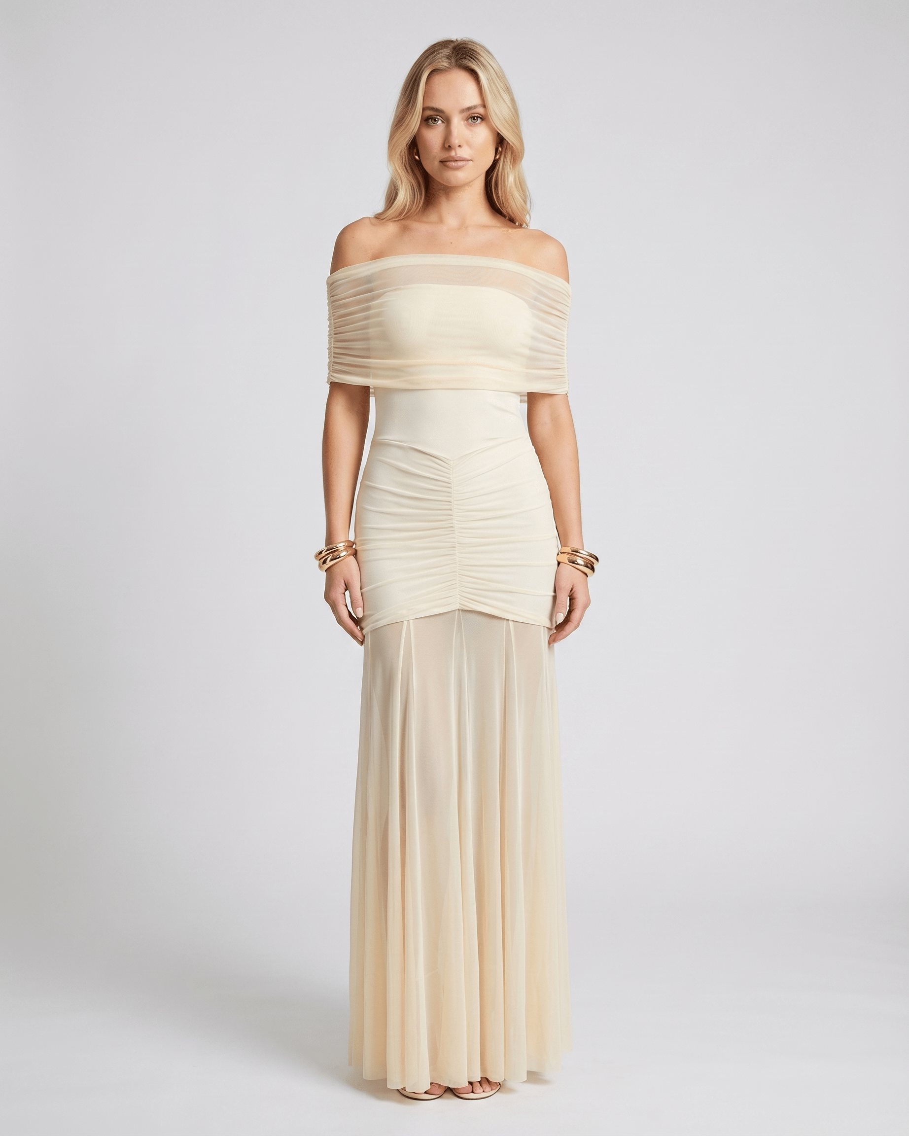 Noirline maxi dress by Lauven, featuring off-shoulder neckline, ruched bodice, elegant flowing sheer panel, and stunning movement.