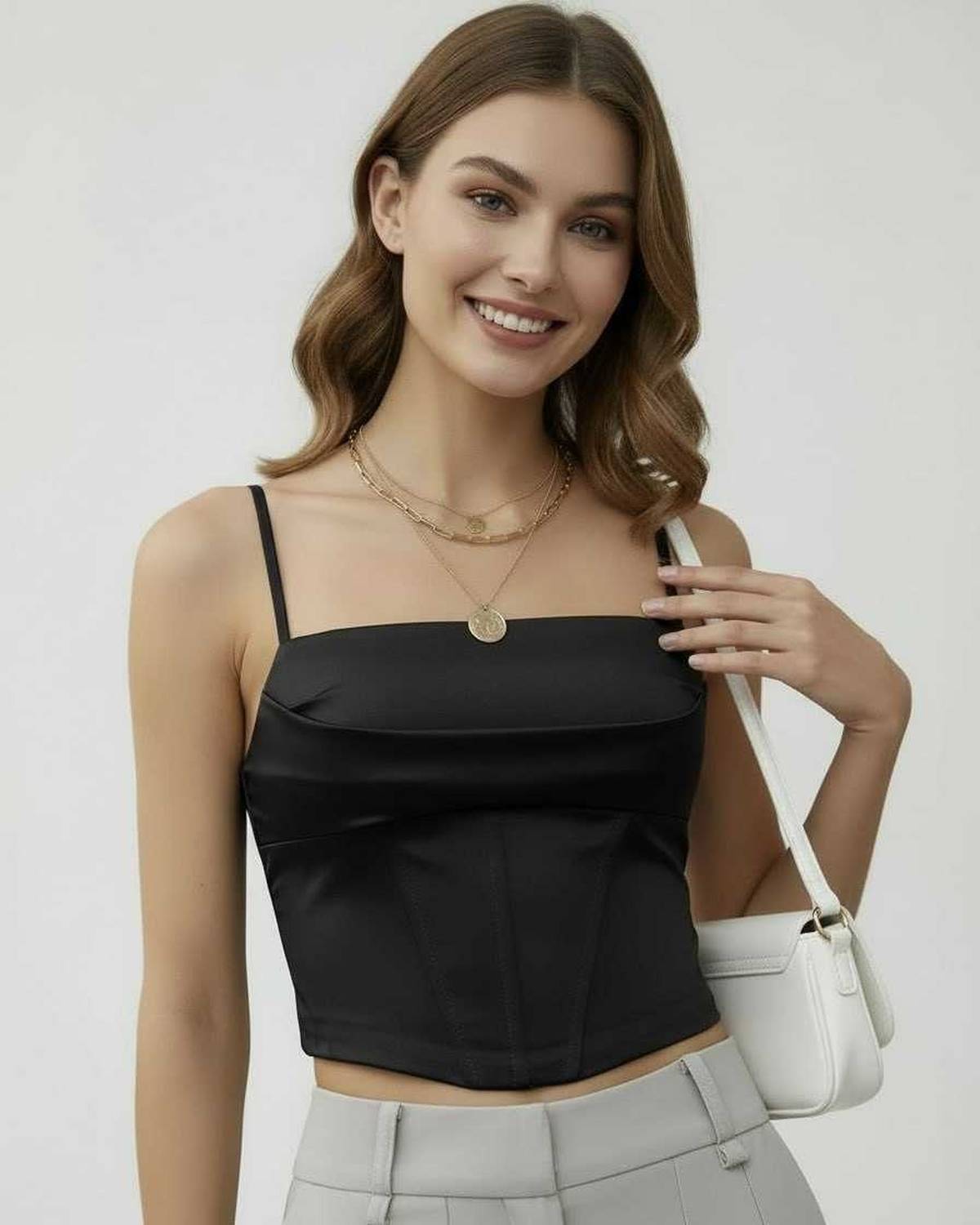 Nova Corset Top by Lauven in sleek black satin, showcasing a contemporary structure and elegant design.