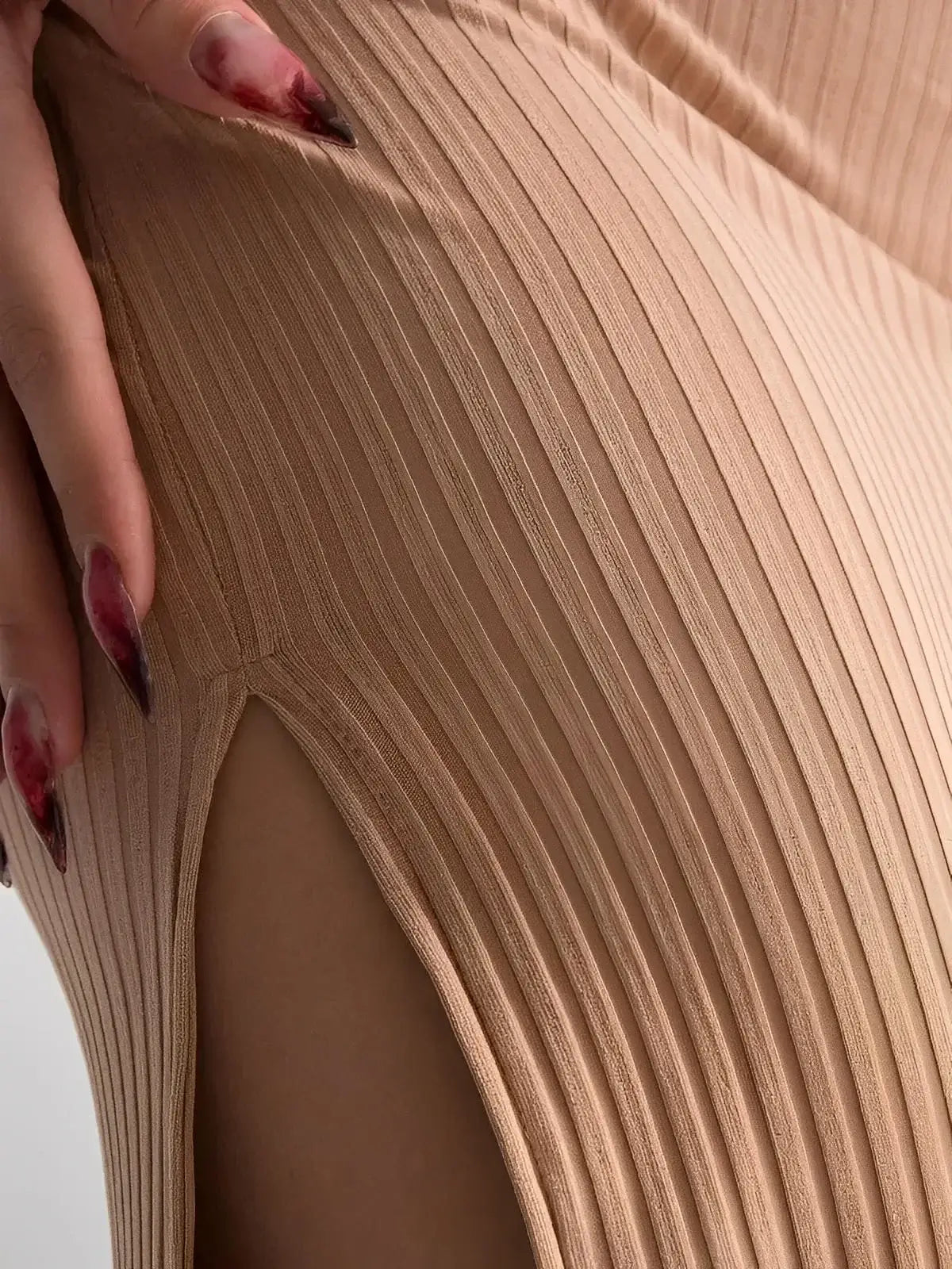 Close-up of the Nude Lace Midi Dress by Lauven showcasing ribbed fabric and thigh-high slit for elegant allure.