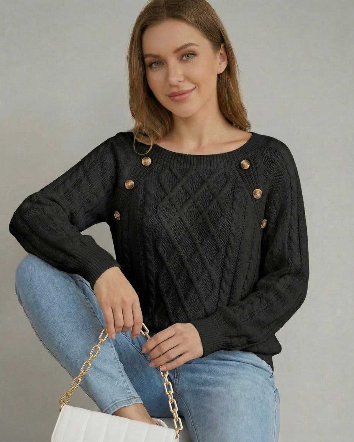 Nyx Pullover by Lauven featuring a black cable knit sweater with square collar and decorative buttons.