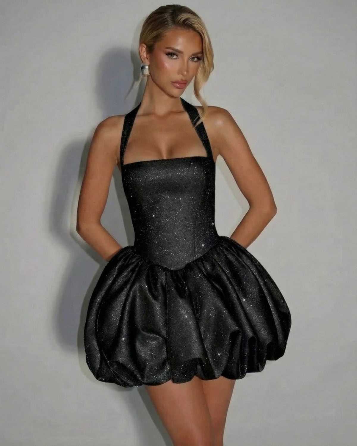 Obsidia Mini Dress by Lauven - a black sequin pouf mini dress with sleeveless design, high-waist silhouette, and elegant sparkle.