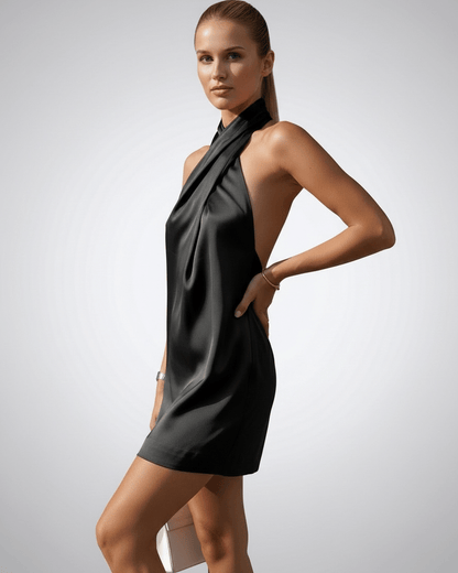 Onyx Mini Dress by Lauven, featuring a black satin straight silhouette and halter neckline.