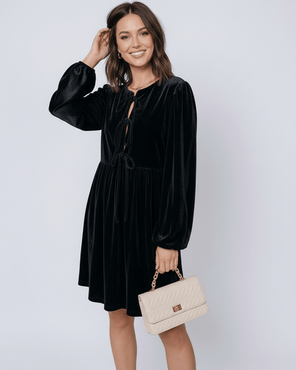 Onyx Mini Dress by Lauven, black velvet princess dress with drawstring detail and long lantern sleeves.