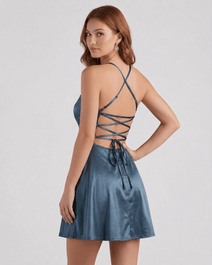 Steel Satin Mini dress by Lauven, featuring a sleek steel blue satin finish and laced back design.