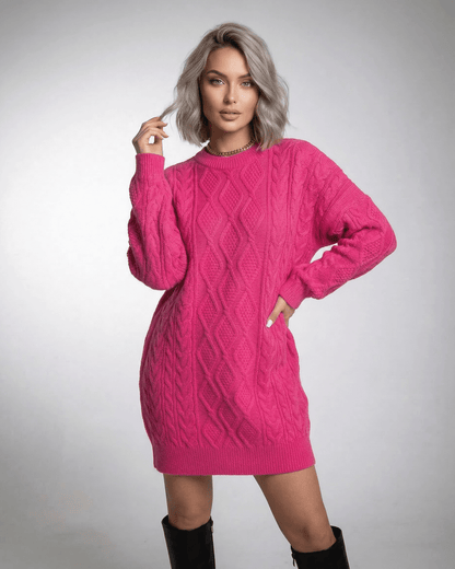 Luna Mini Dress in vibrant pink cable knit by Lauven, featuring long sleeves and a relaxed silhouette.