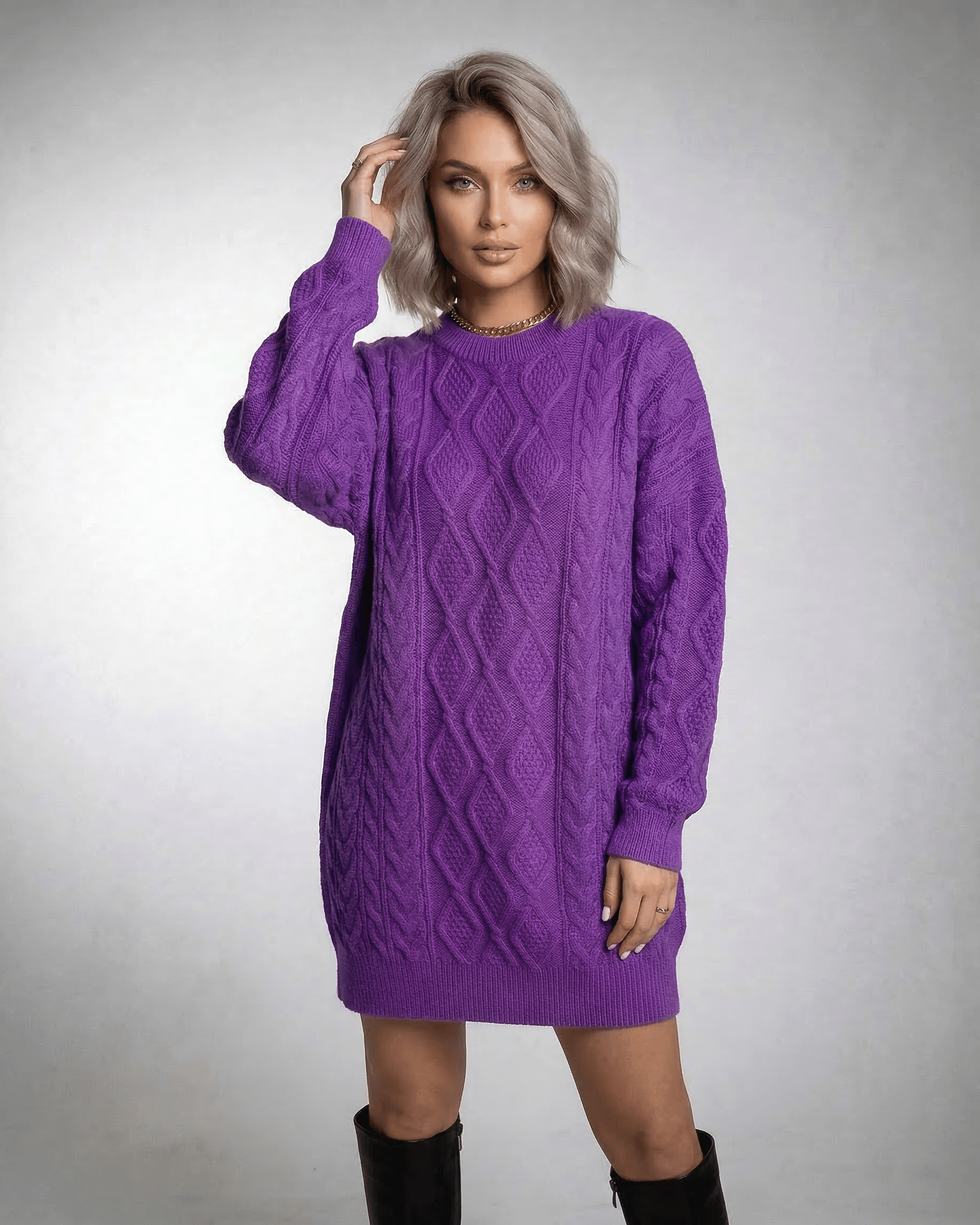 Violet Mini Dress by Lauven, showcasing a vibrant purple cable knit with a relaxed fit and dropped long sleeves.