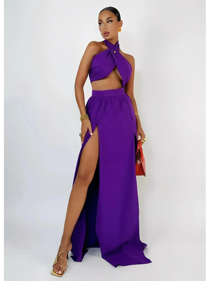 Model wearing a vibrant orchid purple halter top and high-slit maxi skirt set, showcasing a chic summer style.