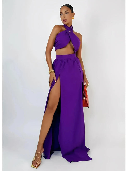 Model wearing a vibrant orchid purple halter top and high-slit maxi skirt set, showcasing a chic summer style.