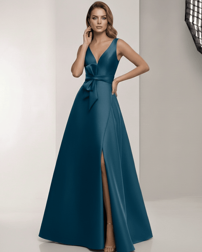 Orion Maxi Dress in teal satin with V-neck and bow detail, perfect for elegant occasions by Lauven.