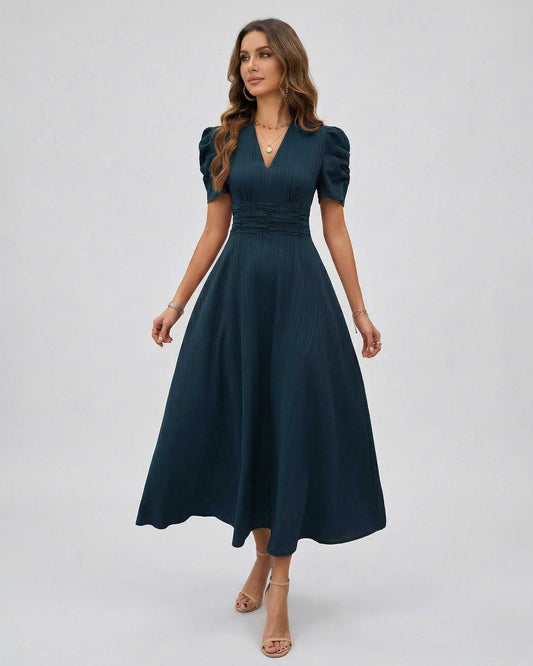 Orion Midi Dress in dark teal showcasing structured puff sleeves, flattering V-neckline, perfect for weddings by Lauven.